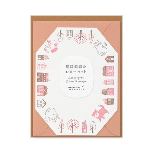 Octogon shape sheet with a border of cats and houses in brown and pink with  a salmon pink envelope.