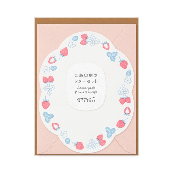 Curvy sheet with blue and red border of strawberry fruit, leaves, and flowers with a pink envelope.