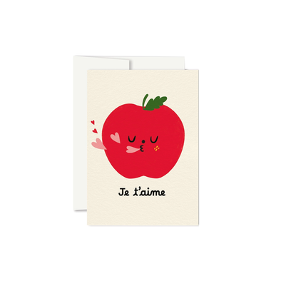 little apple blowing heart-shaped kisses over the cursive text Je t'aime