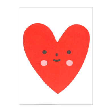 Red heart with a simple smiley face and pink circle cheeks
